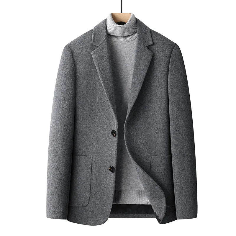 Men's slim fit solid colour wool suit jacket on a hanger, showing non-ironing finish and polyester lining detail.