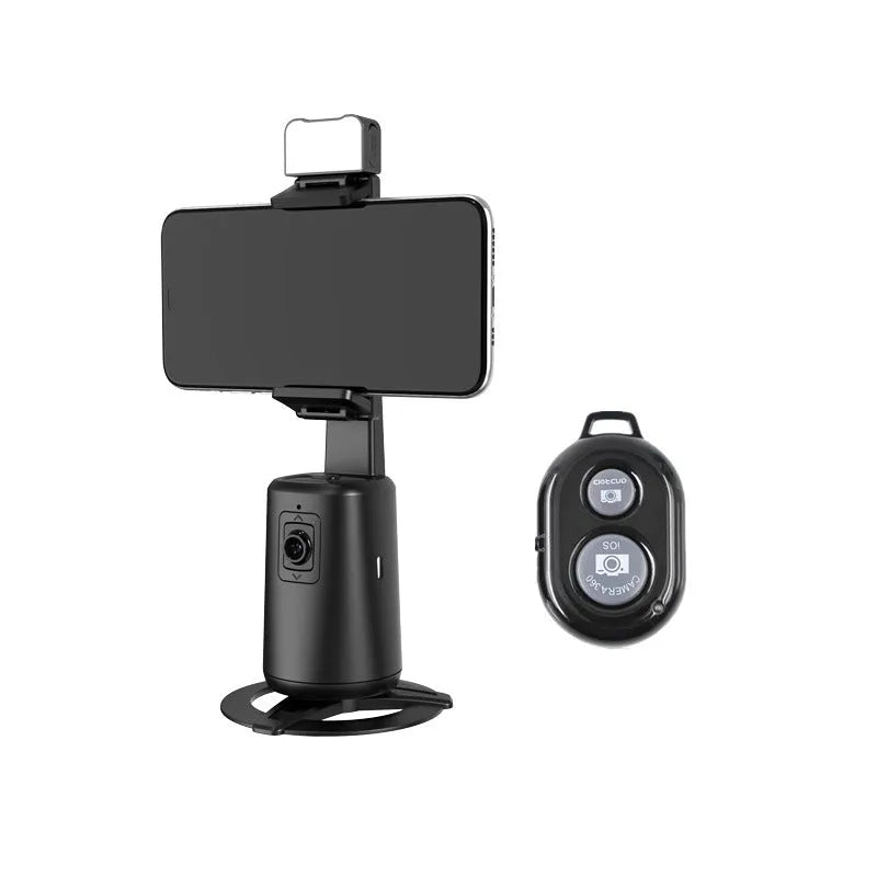 Black desktop mobile phone holder with ribbon lights and remote control for face tracking.