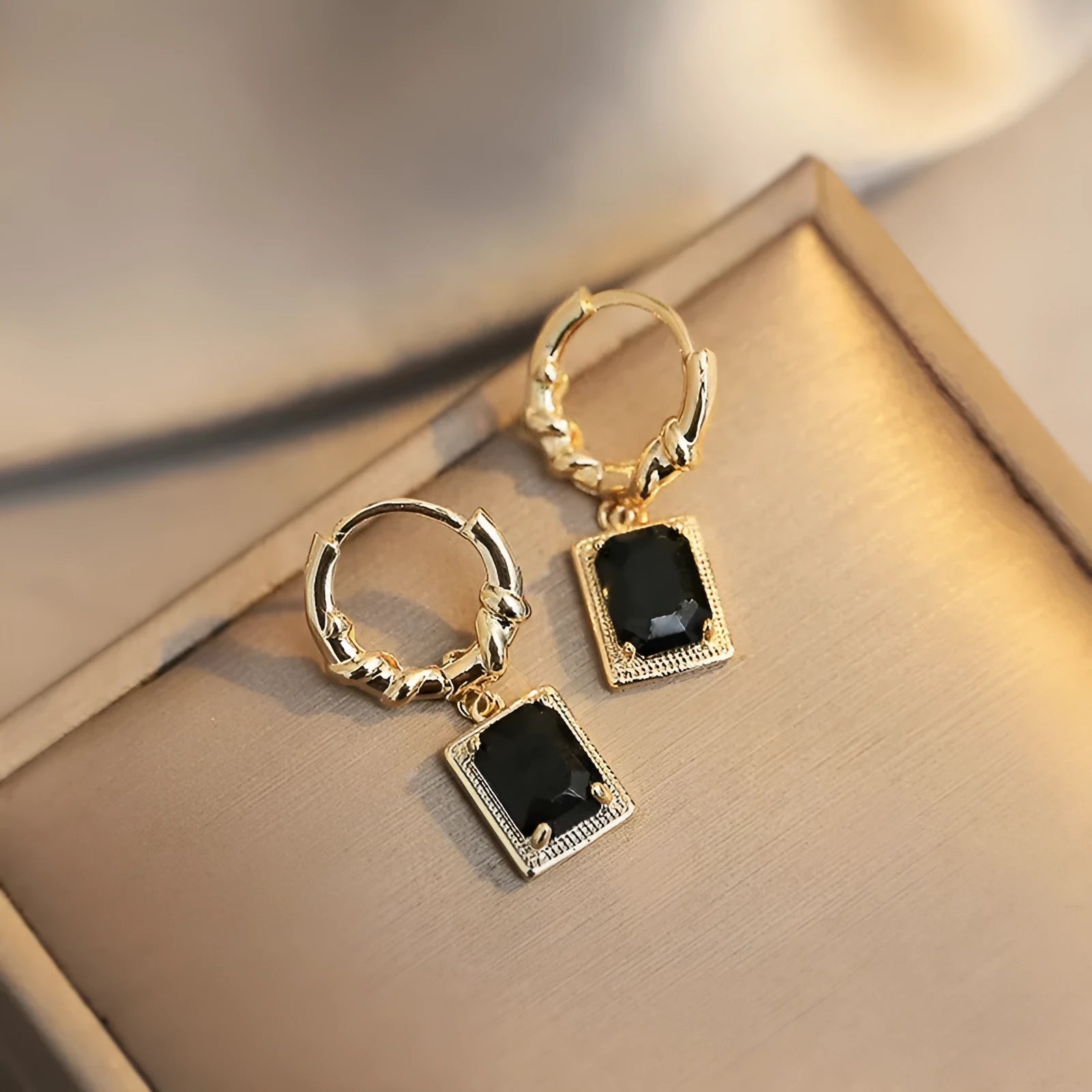 Geometric quadrilateral copper earrings with black zircon crystals in French court retro style