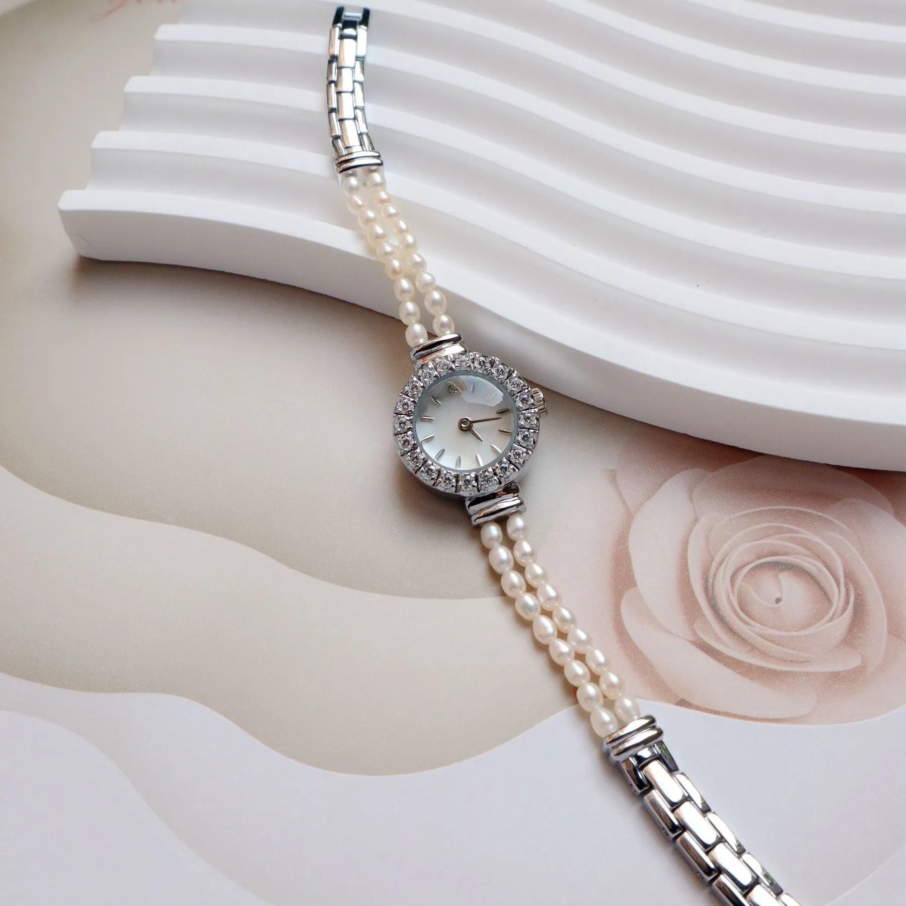 Women's light gold bracelet watch with freshwater pearls and round mineral glass dial