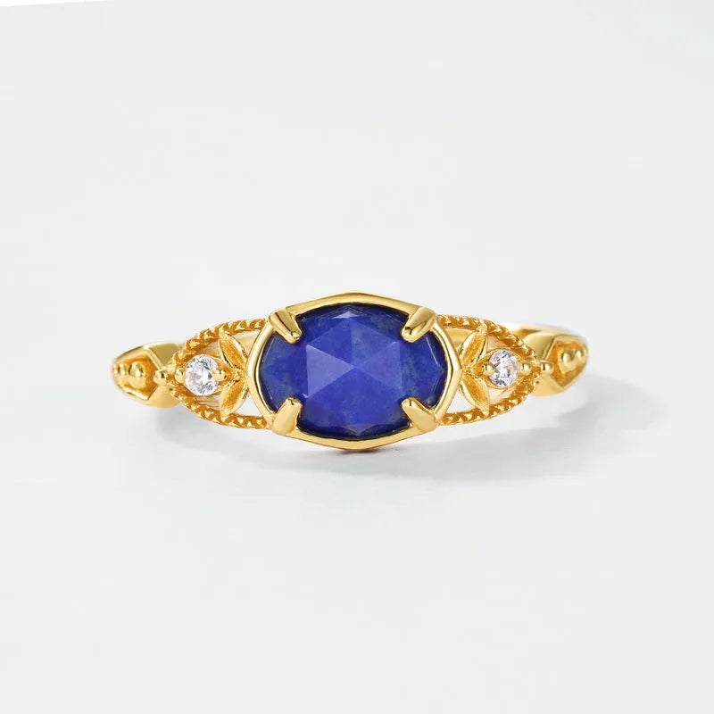 Japanese style geometric ellipse silver alloy ring for women in a lapis lazuli forest night sky colour.