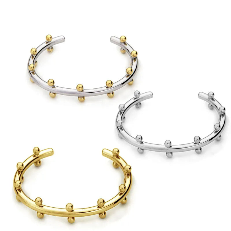 Stainless steel C-shaped beads with rivet texture in gold, steel, and steel gold colours for jewellery making.