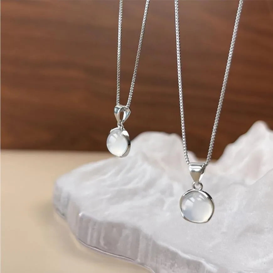Korean-style women's oval pendant necklace with artificial crystal and eight-star design on an adjustable box chain.