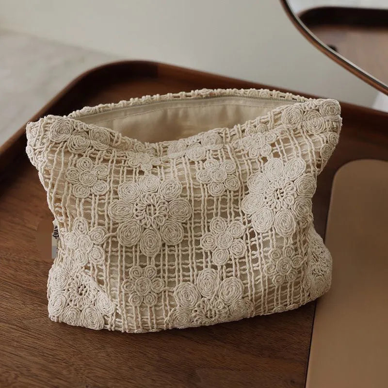 Handmade crocheted corduroy cosmetic bag with hollow flower pattern and ethnic embroidery details
