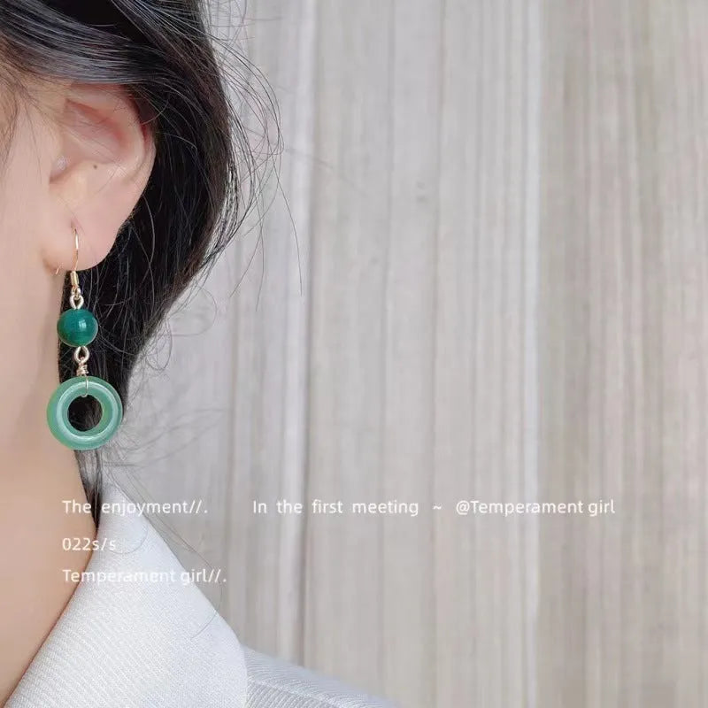 Pair of Chinese style geometric peace buckle earrings with green jade colour and gold plating