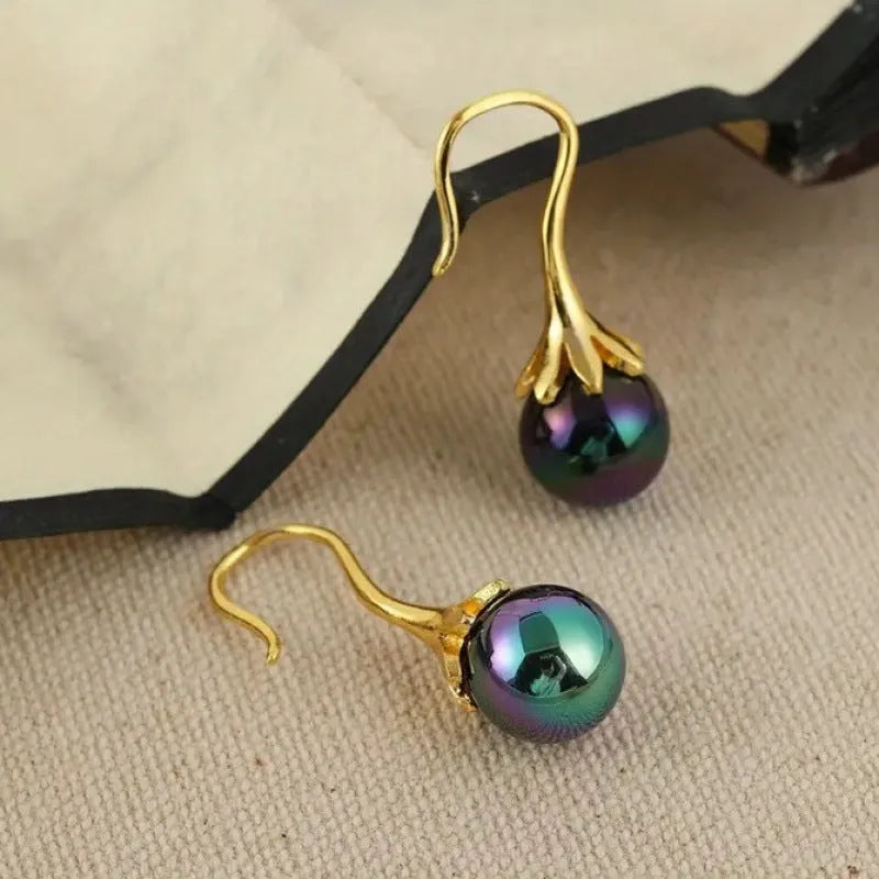 A pair of retro-style women's earrings with an imitation gold electroplated finish on an alloy base.
