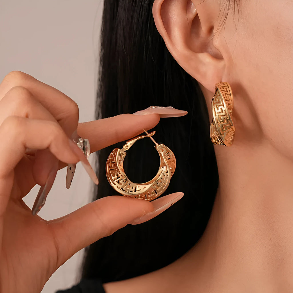 Geometric hollow stud earrings with twisted round design in silver needle-gold or silver needle-silver finish