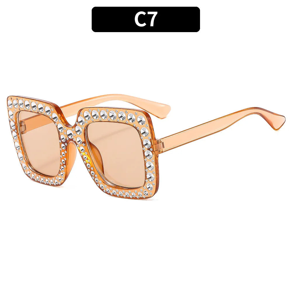Plastic fashion sunglasses in various colour combinations including black frame gray lens and transparent tea frame brown lens options