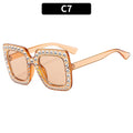 Plastic fashion sunglasses in various colour combinations including black frame gray lens and transparent tea frame brown lens options