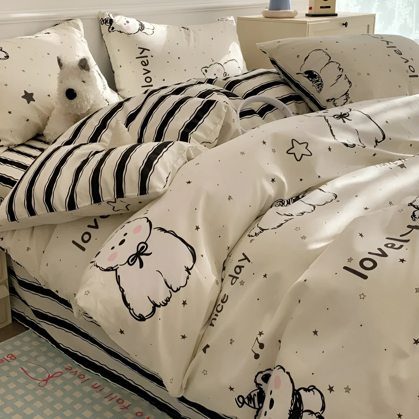 Cartoon dog pattern four-piece cotton bedding set laid on a bed, showing Animal World print design.