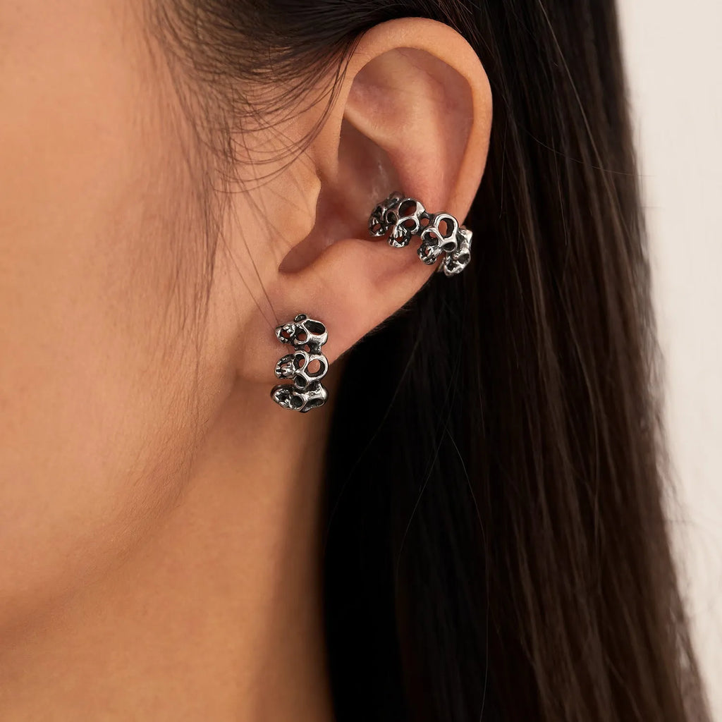 Stainless steel retro hollow skull design earrings with clip fastening