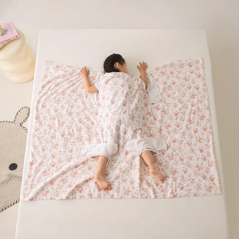 Anti-kick summer blanket in a choice of colours and sizes on a bed.