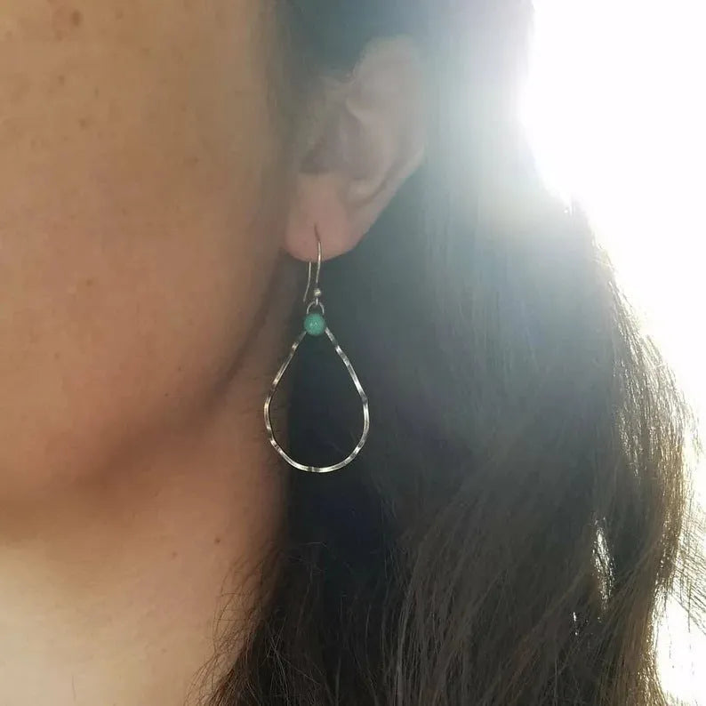A pair of bohemian-style geometric circle earrings in antique silver colour.