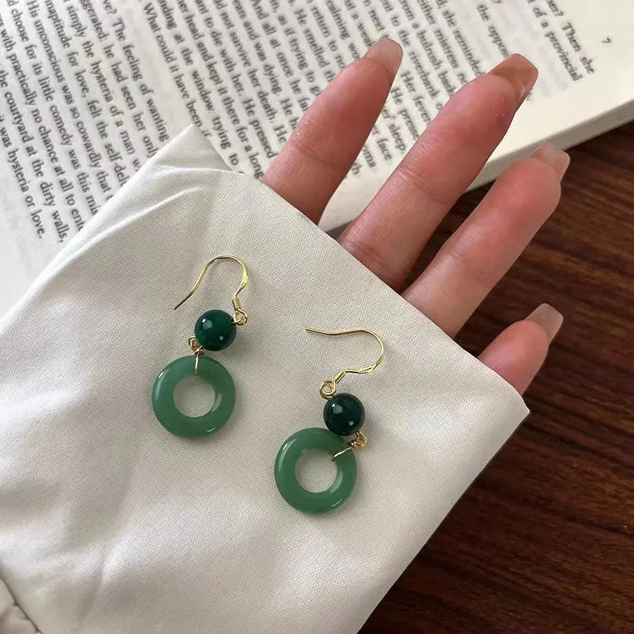 Pair of Chinese style geometric peace buckle earrings with green jade colour and gold plating