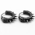A pair of black geometric alloy earrings with copper plastic punk motorcycle detailing.