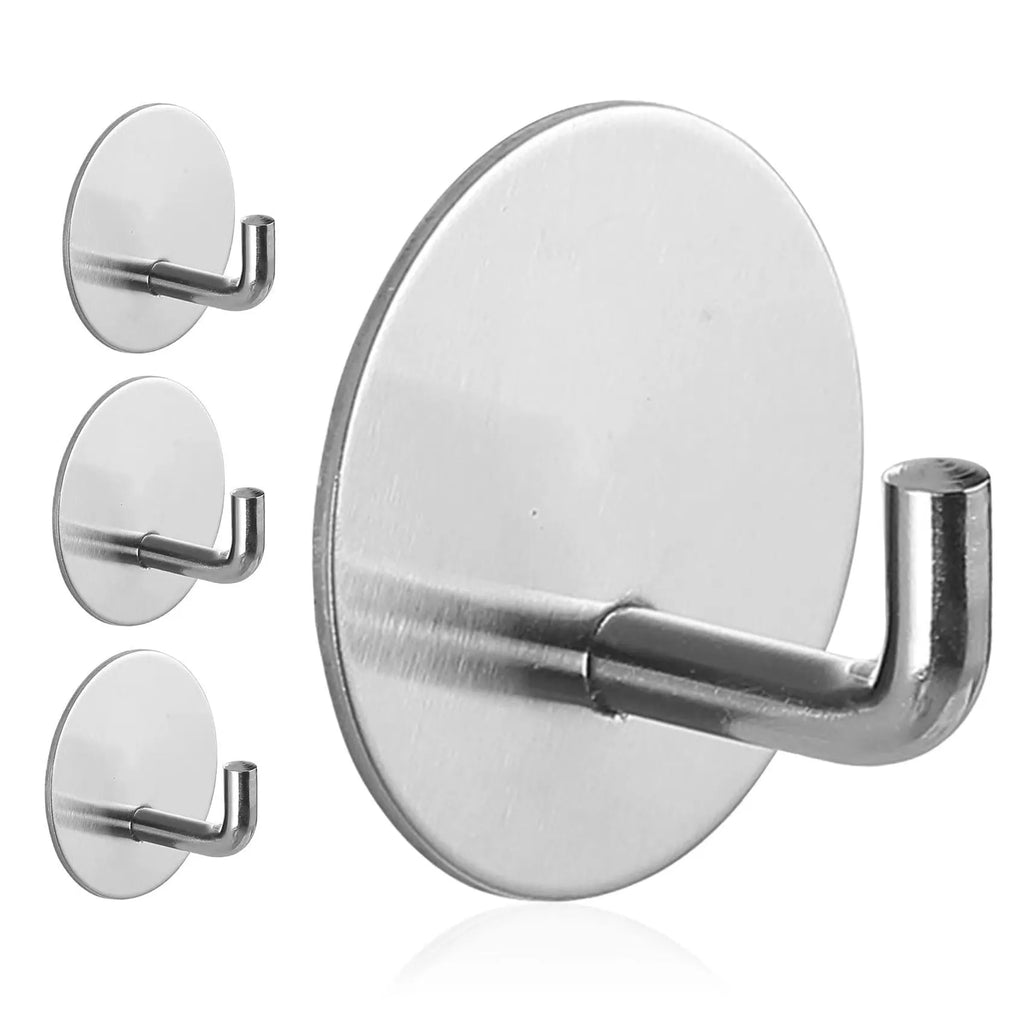 Round stainless steel self-adhesive hook in black and polished finishes for wall mounting.