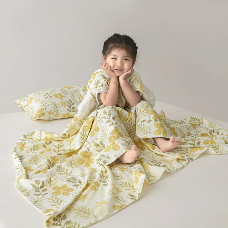 Anti-kick summer blanket in a choice of colours and sizes on a bed.