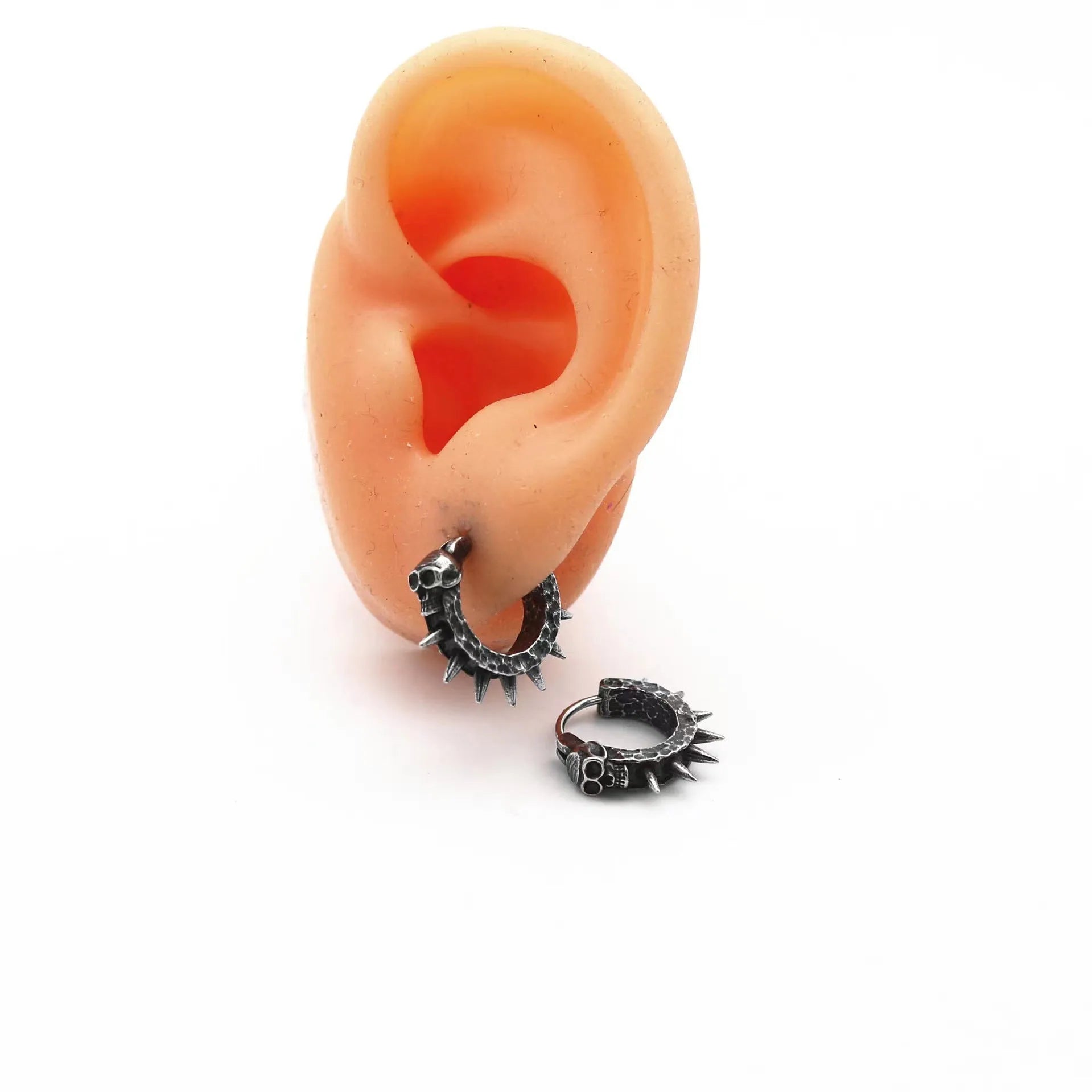 A pair of black geometric alloy earrings with copper plastic punk motorcycle detailing.