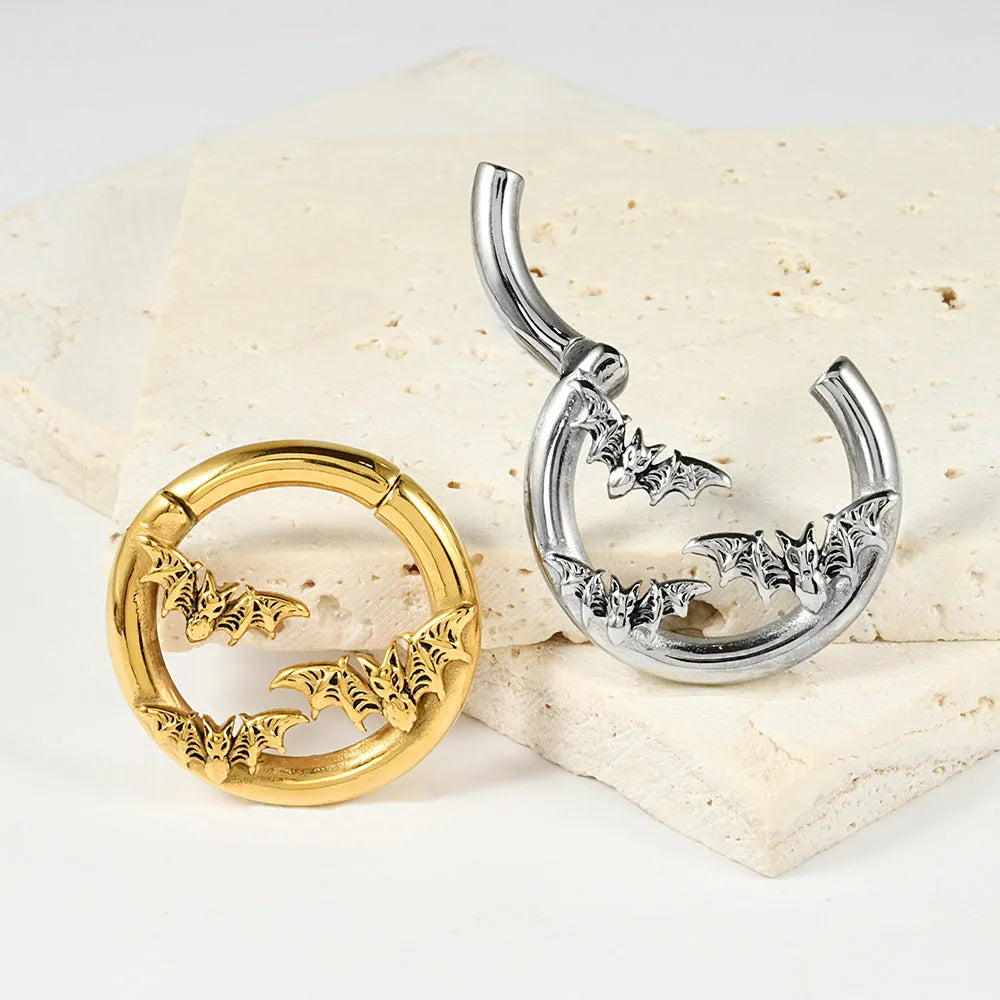 A pair of stainless steel fashion earrings featuring a detailed totem pattern, shown in one of fifteen available colour finishes.