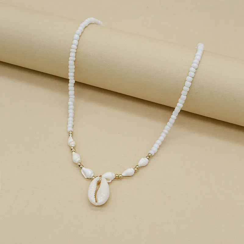 White conch bead necklace with genuine mother of pearl shell pendant on regular chain