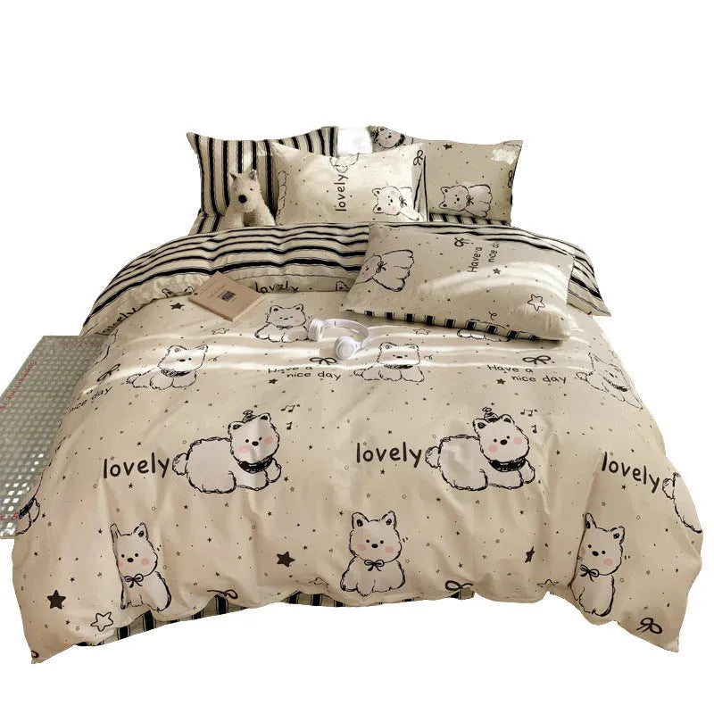 Cartoon dog pattern four-piece cotton bedding set laid on a bed, showing Animal World print design.