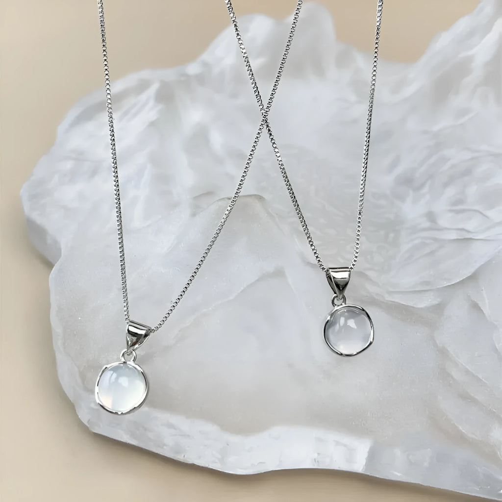 Korean-style women's oval pendant necklace with artificial crystal and eight-star design on an adjustable box chain.