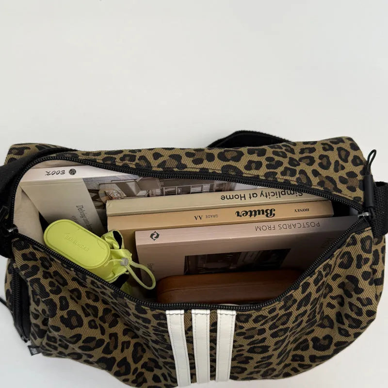 Leopard print sports style cross-body messenger bag with large capacity and cloth construction