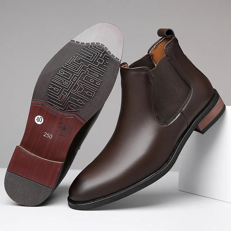 Men's black pointed toe Chelsea boots with a mid-calf height and rubber sole.
