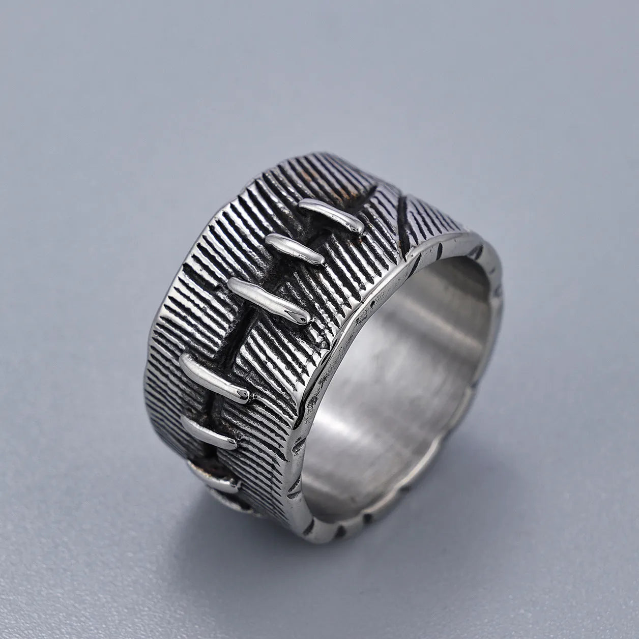 Geometric U-shaped titanium steel punk ring with double-ring construction in dark retro colour.
