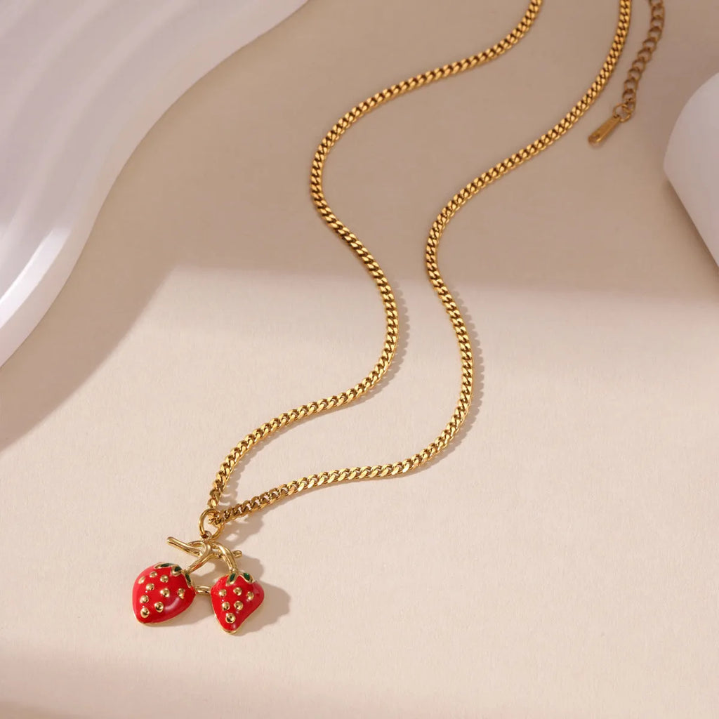 Strawberry-shaped pendant necklace in stainless steel with white or red colour options
