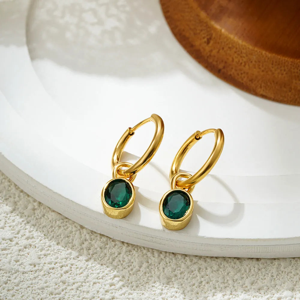 Women's retro simple oval zircon earrings in copper, showing the elliptical design on a model.