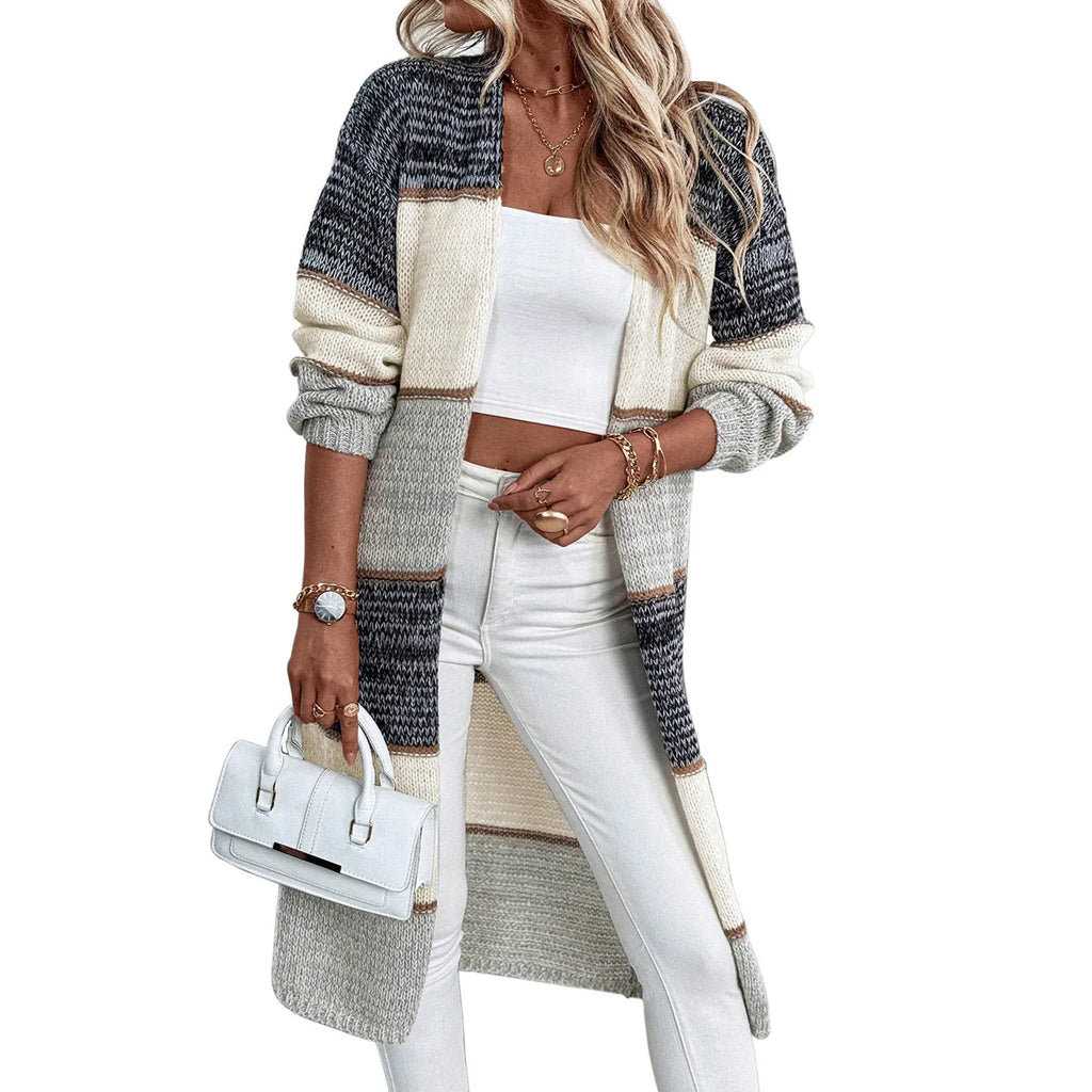 Women's grey knitted long cardigan with loose fit and stripe plaid pattern on hanger