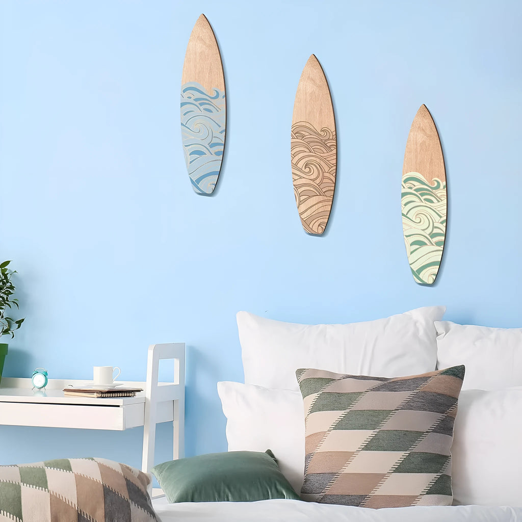 Three identical wooden surfboard wall decorations with natural wood finish