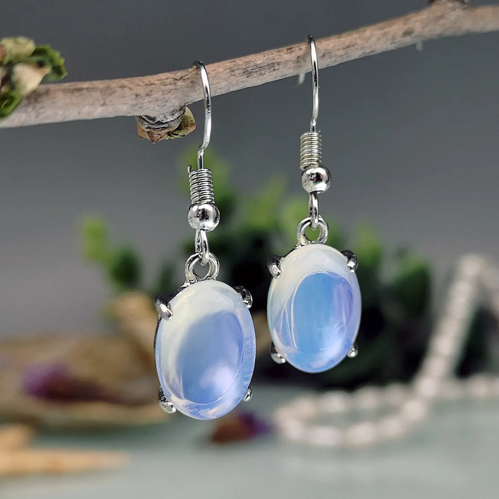 Moonlight white opal-inspired cross earrings with drop shape and electroplated alloy construction