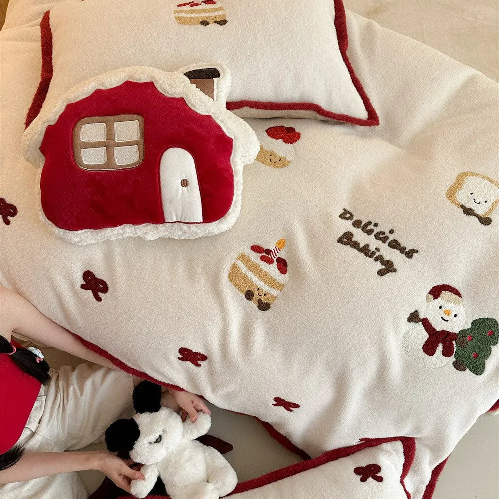 Snowman Milk Pastry cartoon print bedding four-piece set including sheet, duvet cover, and pillowcases on a bed.
