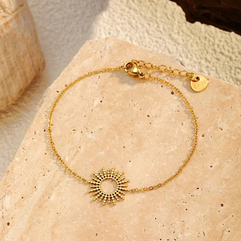 Gold sunflower bracelet and necklace set with geometric chain design