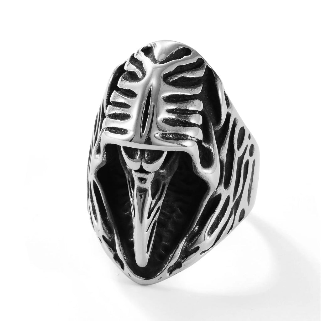 Titanium steel geometric crow punk ring in MR166 colour on a plain background.