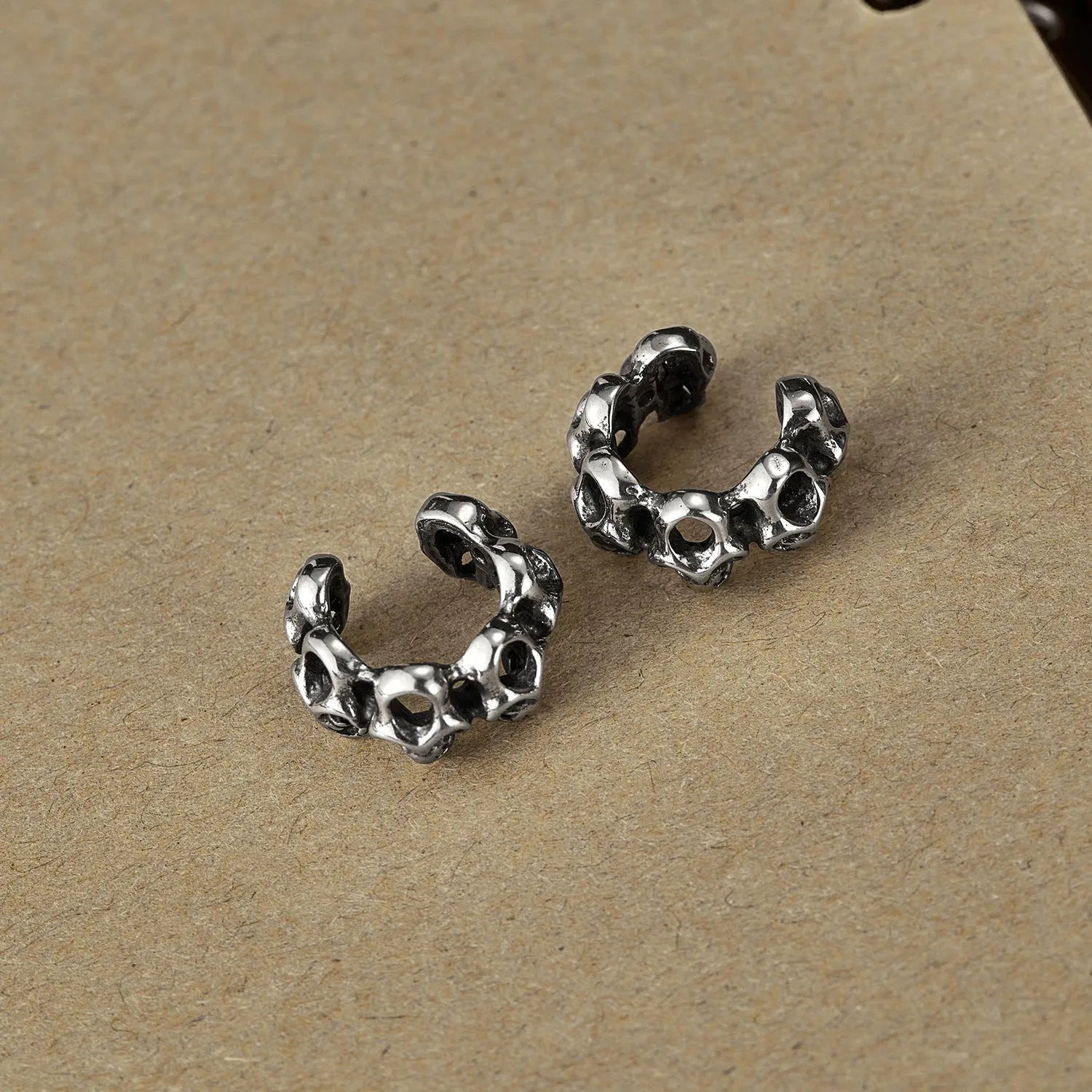 Stainless steel retro hollow skull design earrings with clip fastening