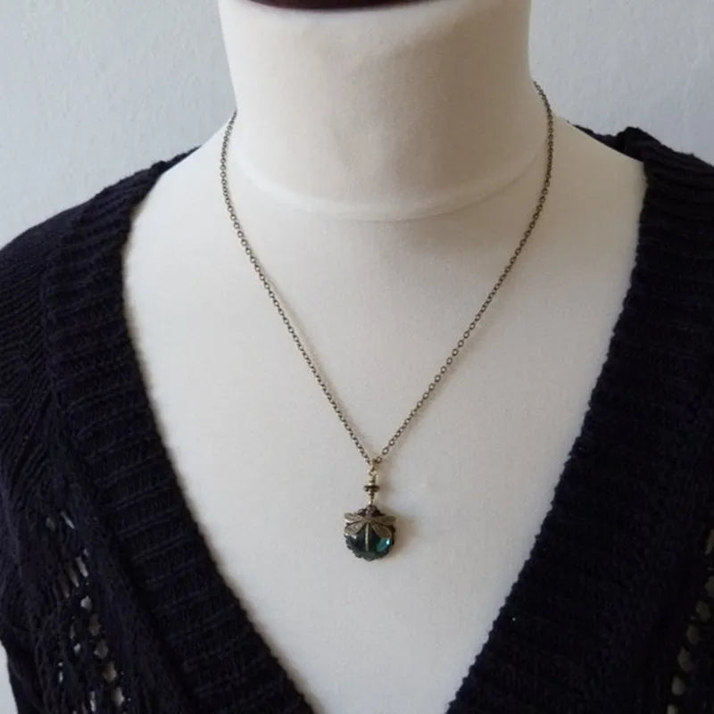 Yellow vintage bronze dragonfly pendant necklace on adjustable silver chain