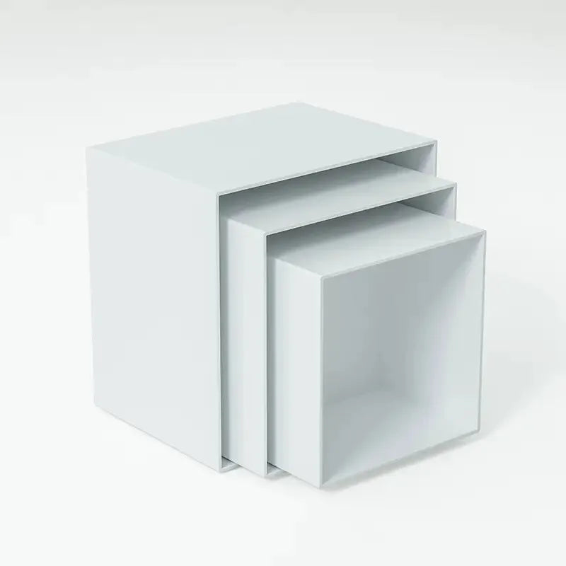 White plastic suit cube dessert display stand with six individual cubes for wedding cakes and pastries.