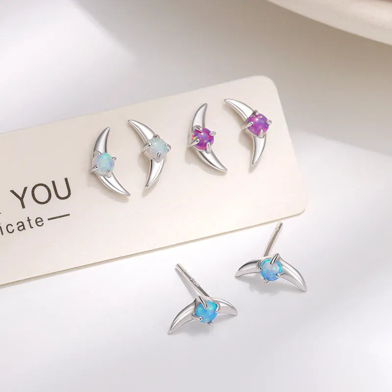 Geometric 925 silver earrings with electroplated gold or platinum finish and coloured stone.