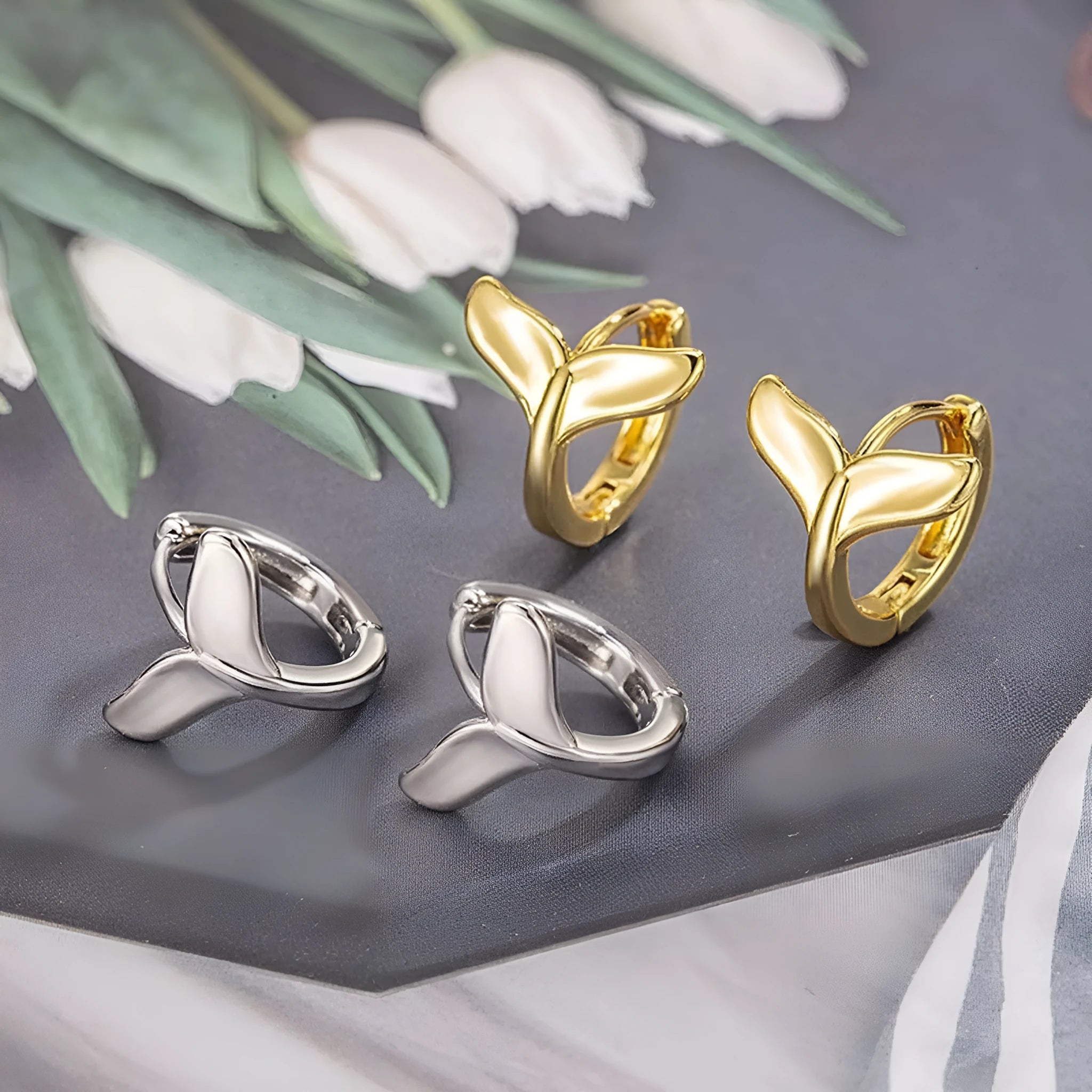 Women's fishtail design earrings in electroplated white gold or yellow gold colour on copper