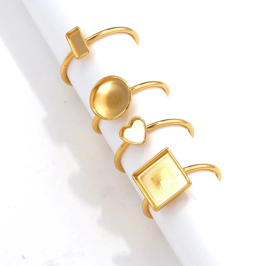 Golden electroplated stainless steel ring setting with totem pattern in various oval, rectangle, round and heart shapes