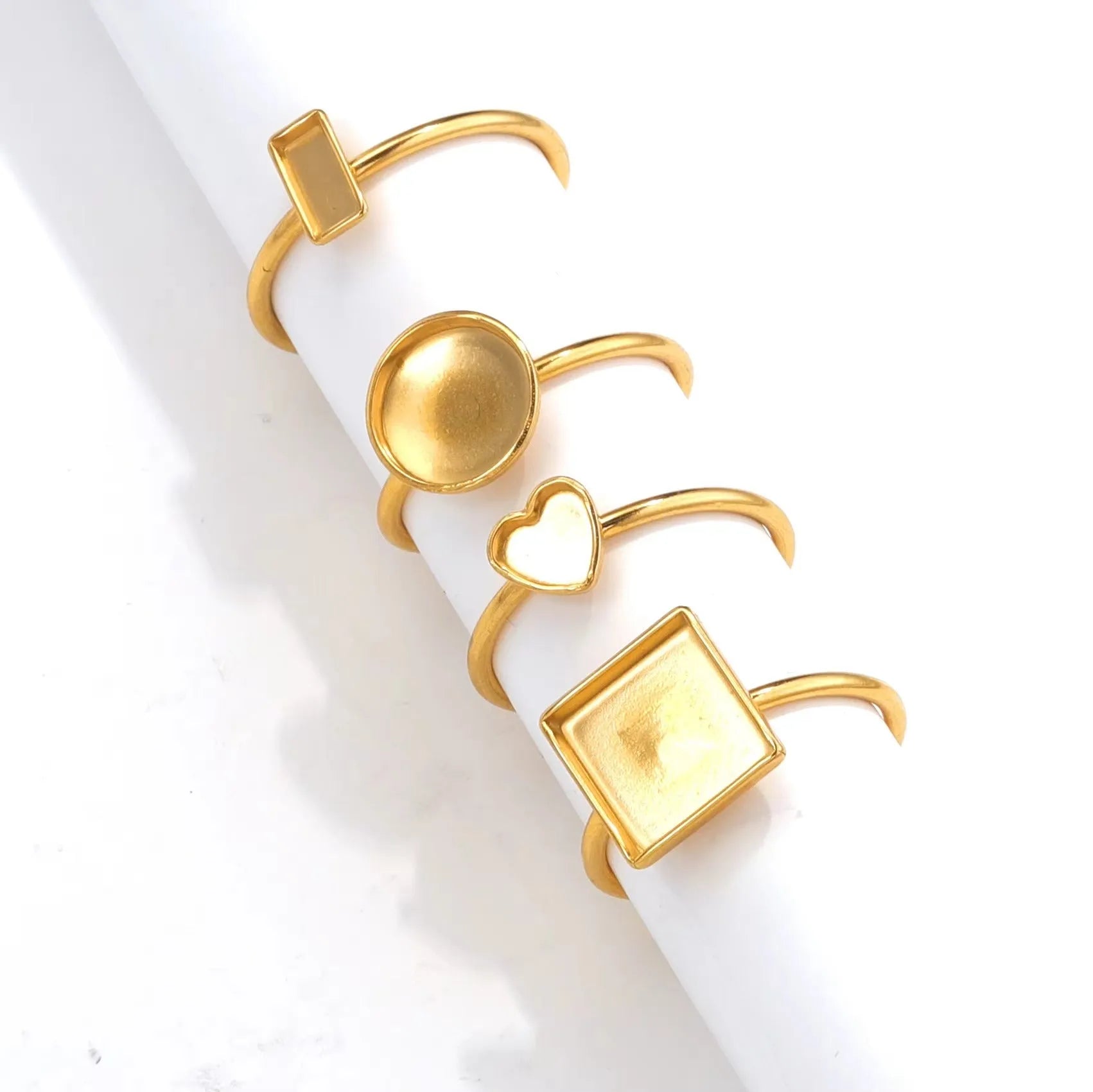 Golden electroplated stainless steel ring setting with totem pattern in various oval, rectangle, round and heart shapes