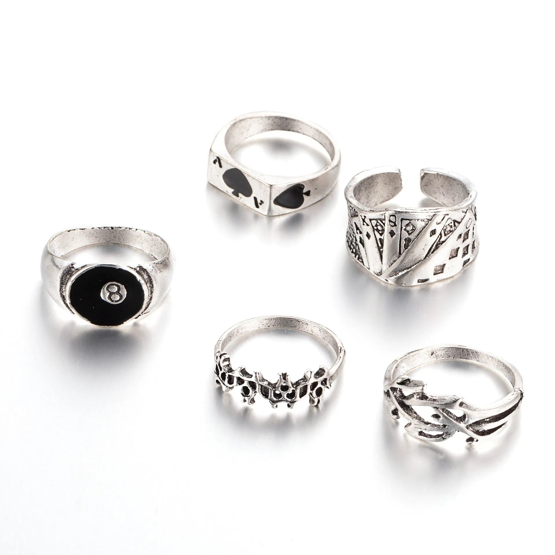 Black alloy adjustable ring with a raised retro spade playing card design on a model's hand.