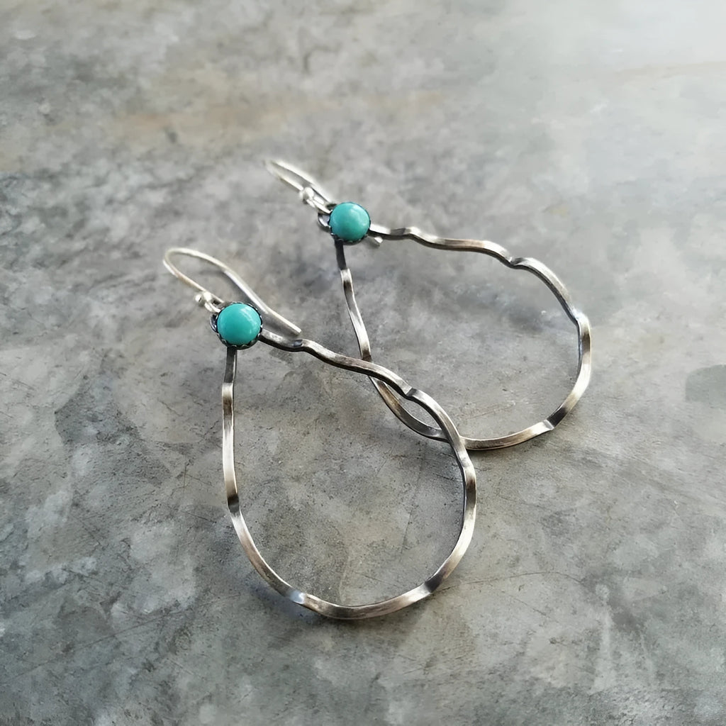 A pair of bohemian-style geometric circle earrings in antique silver colour.