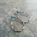 A pair of bohemian-style geometric circle earrings in antique silver colour.