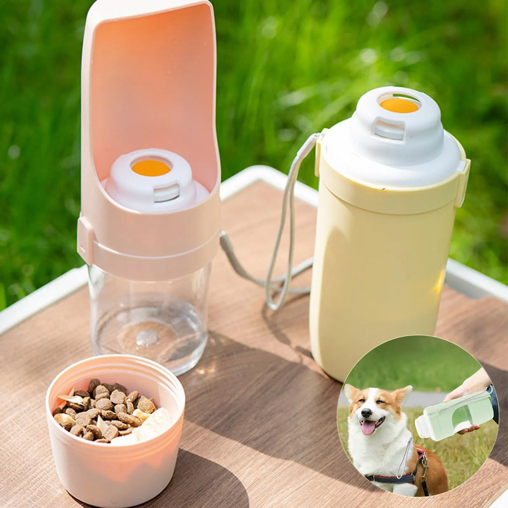 Grey folding travel dog water bottle with attached lanyard and separate food container, shown next to a backpack.