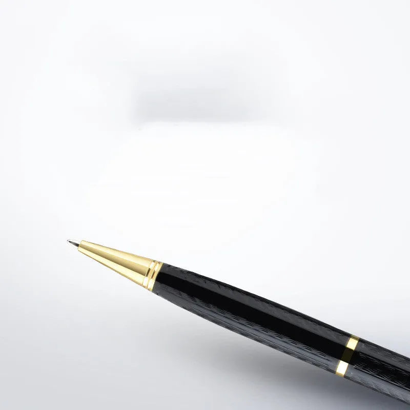 Black pen shaped voice recorder with zinc alloy shell shown alongside included headset and data cable