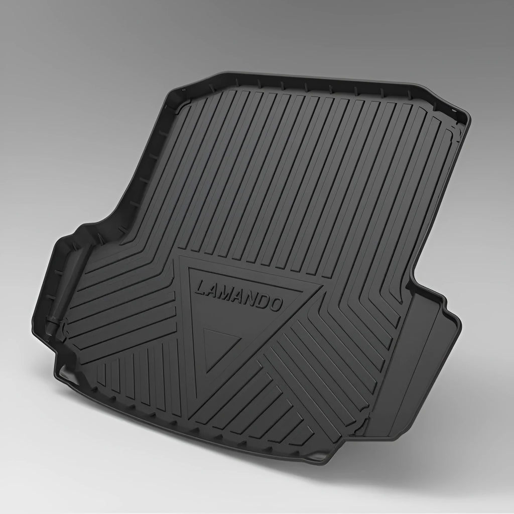 Black carbon fibre pattern TPE trunk pad installed in a car boot showing custom fit and textured surface